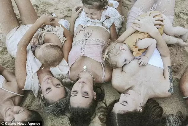 Stunning photos capture the deep bond between mother and child through breastfeeding moments on the beach, celebrating resilience and postpartum love.